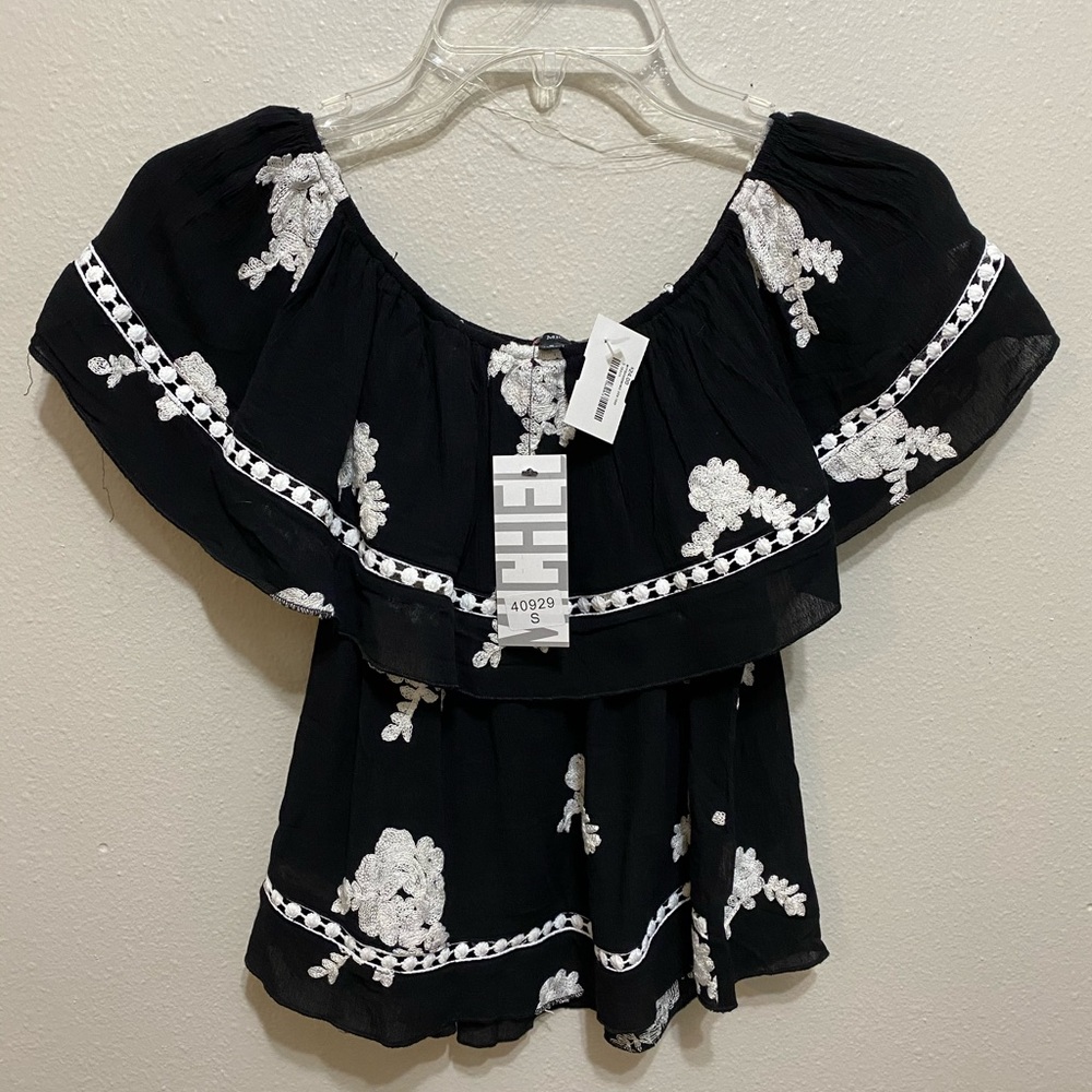 Black off the shoulder top with embroidery detail